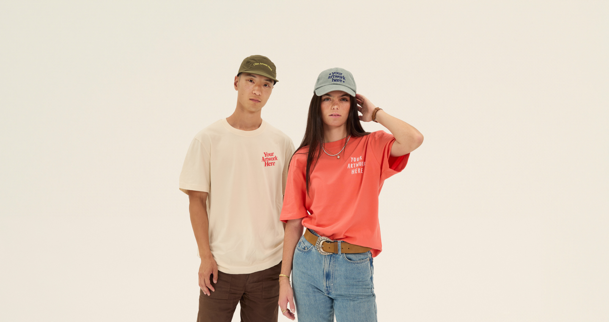 Man and woman wearing custom printed caps and tees